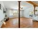 Open concept living room with exposed beam, hardwood floors and natural light at 1895 Emerson Ave, Bartow, FL 33830