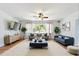Spacious living room with tasteful furniture, decor, and a ceiling fan at 1895 Emerson Ave, Bartow, FL 33830