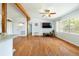 Open concept living room with exposed beams and hardwood floors at 1895 Emerson Ave, Bartow, FL 33830