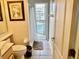 Bathroom with tile flooring, toilet, shower and bath. Pool is visible through bathroom door at 242 Prestwick Dr, Davenport, FL 33897