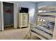 Bedroom with bunk beds, dresser, TV, and closet at 242 Prestwick Dr, Davenport, FL 33897