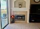 Living room fireplace with decorative mantle and sliding glass doors to the pool area at 242 Prestwick Dr, Davenport, FL 33897