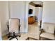 Spacious living room with comfortable furniture and a view to the main bedroom at 242 Prestwick Dr, Davenport, FL 33897