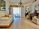 Bright living room with tile flooring and access to the outdoor patio at 242 Prestwick Dr, Davenport, FL 33897