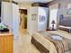 Spacious primary bedroom featuring a walk-in shower, jacuzzi, tile floors, and refined decor at 242 Prestwick Dr, Davenport, FL 33897