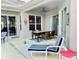 Relaxing covered patio with dining area and comfortable seating at 242 Prestwick Dr, Davenport, FL 33897
