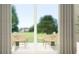 Outdoor patio features seating with view of lush green yard at 2644 Skyline Loop, Kissimmee, FL 34758