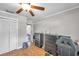 Bedroom features a window, ceiling fan, a desk, and closet doors; great for storage at 424 Forest Glen Ave, Lakeland, FL 33813