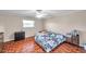 Bright bedroom with neutral walls, ceiling fan, and parquet flooring throughout at 424 Forest Glen Ave, Lakeland, FL 33813