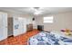 Comfortable bedroom with natural light, ceiling fan, and parquet flooring throughout at 424 Forest Glen Ave, Lakeland, FL 33813