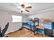Bedroom with bunk beds, a ceiling fan, a window, and a small desk; great for shared living at 424 Forest Glen Ave, Lakeland, FL 33813
