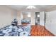 Comfortable bedroom with natural light, ceiling fan, mirrored closet, and parquet flooring at 424 Forest Glen Ave, Lakeland, FL 33813