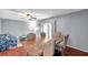 Cozy dining room with hardwood floors and a ceiling fan at 424 Forest Glen Ave, Lakeland, FL 33813