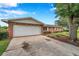 Spacious garage with an expansive driveway offering plenty of parking at 424 Forest Glen Ave, Lakeland, FL 33813