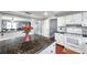 Well-maintained kitchen with white cabinets, a breakfast bar, and hardwood floors at 424 Forest Glen Ave, Lakeland, FL 33813