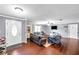 Spacious living room featuring hardwood floors, neutral paint, and comfortable seating at 424 Forest Glen Ave, Lakeland, FL 33813