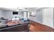 Comfortable living room featuring hardwood floors, a ceiling fan, and gray walls at 424 Forest Glen Ave, Lakeland, FL 33813