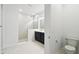 Bathroom featuring tile flooring, a shower, and a single vanity sink at 5914 Bristle Oak St, Mount Dora, FL 32757