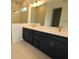 Modern bathroom featuring double sinks, vanity and stand up shower at 5914 Bristle Oak St, Mount Dora, FL 32757