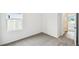Bedroom features neutral walls, carpeted floors, and a window that provides natural light at 5914 Bristle Oak St, Mount Dora, FL 32757