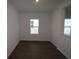 Bright room with dark wood flooring and a window for natural light at 5914 Bristle Oak St, Mount Dora, FL 32757