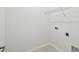A laundry room with neutral tile flooring, white walls, and wire shelving at 5914 Bristle Oak St, Mount Dora, FL 32757