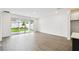 Bright living room with sliding glass doors to backyard with green grass at 5914 Bristle Oak St, Mount Dora, FL 32757