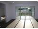 Living room with hardwood floors and large sliding glass doors to the outside at 5914 Bristle Oak St, Mount Dora, FL 32757