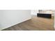 Open living space featuring modern kitchen with black island and dark wood flooring at 5914 Bristle Oak St, Mount Dora, FL 32757
