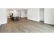 Open living space featuring eat-in kitchen, dark wood flooring, and modern design at 5914 Bristle Oak St, Mount Dora, FL 32757