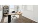 Bright office space with a unique desk and ample natural light from a large window at 5914 Bristle Oak St, Mount Dora, FL 32757