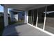 Covered outdoor patio with sliding glass doors and views of the backyard at 5914 Bristle Oak St, Mount Dora, FL 32757
