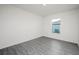 Clean bedroom with hard surface floors and a window bringing in natural light at 113 Cimarron Ln, Poinciana, FL 34759
