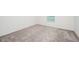 Spacious bedroom showing neutral carpet and a window with backyard views at 113 Cimarron Ln, Poinciana, FL 34759