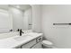 Clean bathroom featuring a single vanity with quartz countertop, a sleek black faucet, and a tiled shower at 6051 Sacred Oak Ave, Mount Dora, FL 32757
