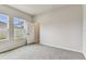 Comfortable bedroom features carpeted floors and two windows allowing ample light at 6051 Sacred Oak Ave, Mount Dora, FL 32757