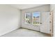 Cozy bedroom featuring carpeted floors and two windows offering natural light at 6051 Sacred Oak Ave, Mount Dora, FL 32757