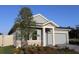 Well-maintained single-Gathering home with a two-car garage and attractive landscaping at 6051 Sacred Oak Ave, Mount Dora, FL 32757