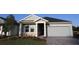 Charming single-Gathering home with attached two-car garage and well-maintained landscaping at 6051 Sacred Oak Ave, Mount Dora, FL 32757