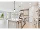 Contemporary kitchen with stainless steel appliances, island, and ample counter space at 6051 Sacred Oak Ave, Mount Dora, FL 32757
