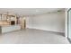 Bright open-concept space with kitchen featuring an island and modern pendant lighting at 6051 Sacred Oak Ave, Mount Dora, FL 32757