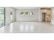 Open living space with tiled floors, natural light, and patio access at 6051 Sacred Oak Ave, Mount Dora, FL 32757