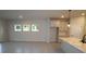 Open-concept living room featuring plenty of natural light and tile flooring throughout at 6051 Sacred Oak Ave, Mount Dora, FL 32757