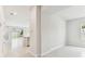 Open living space with tile flooring, access to backyard and view of kitchen at 6051 Sacred Oak Ave, Mount Dora, FL 32757