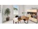 Bright, modern office space features a sleek desk, stylish storage, and natural light at 6051 Sacred Oak Ave, Mount Dora, FL 32757