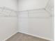 Walk-in closet interior showcasing wire shelving providing ample storage space for an organized wardrobe at 6051 Sacred Oak Ave, Mount Dora, FL 32757