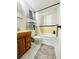 Bathroom with yellow tile backsplash, a combination shower and tub, and a marble style floor at 1690 S Mcadoo Ave, Bartow, FL 33830