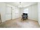 Bright office space featuring neutral carpet, bright window, and a glass chandelier at 1690 S Mcadoo Ave, Bartow, FL 33830