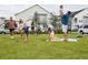 Residents are enjoying the outdoors with friends and Gathering on a green space in the community at 16958 Cedar Valley Cir, Clermont, FL 34711