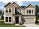 Charming two-story home featuring a two-car garage and a beautifully landscaped front yard at 16958 Cedar Valley Cir, Clermont, FL 34711